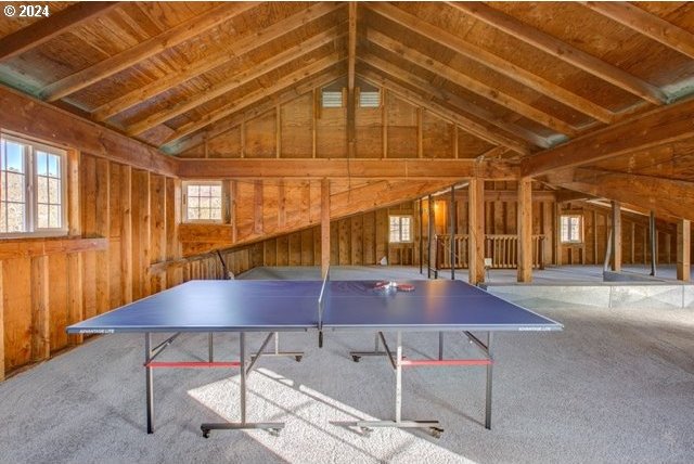 1381 Echo Dr, Roseburg, OR 97470 - game room featuring vaulted ceiling, carpet flooring, and wood walls