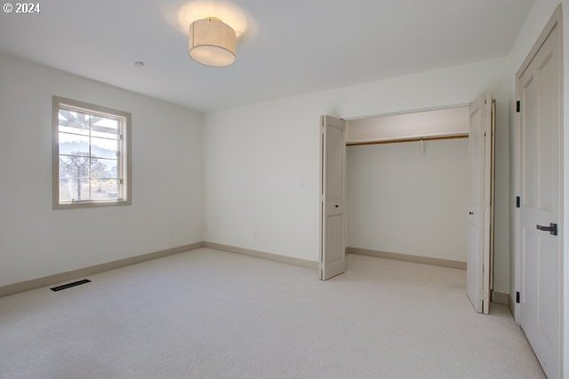 1381 Echo Dr, Roseburg, OR 97470 - unfurnished bedroom with light carpet, a closet, and baseboards