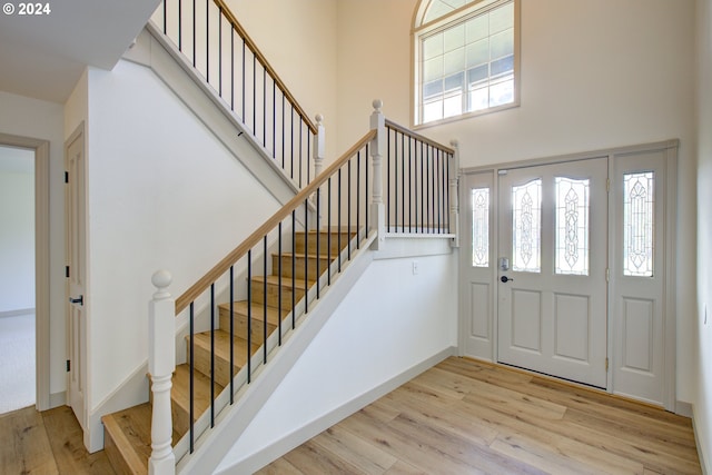 1381 Echo Dr, Roseburg, OR 97470 - entryway featuring wood finished floors, a high ceiling, and stairs
