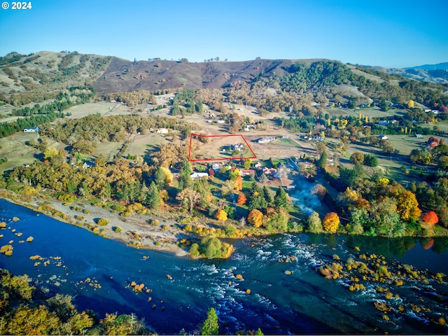 aerial view with a water and mountain view