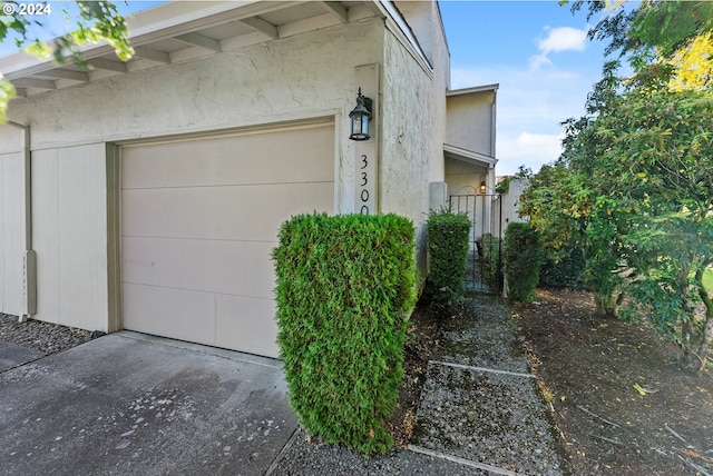 view of property exterior featuring a garage