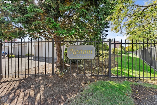 view of gate featuring a yard