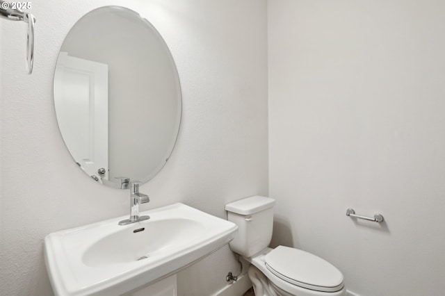 bathroom with toilet and sink