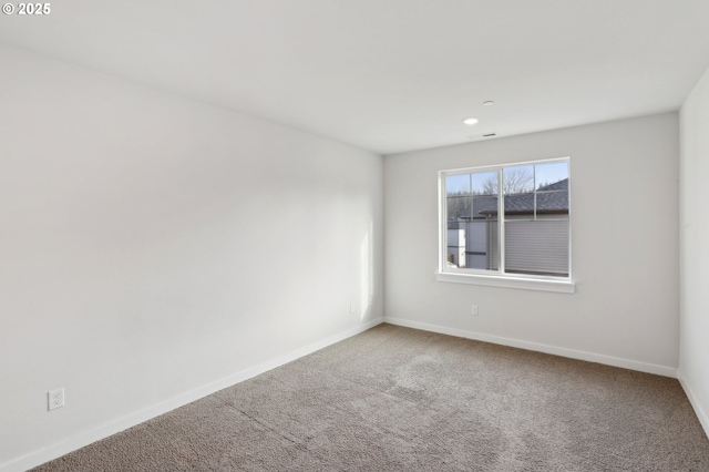 unfurnished room with carpet