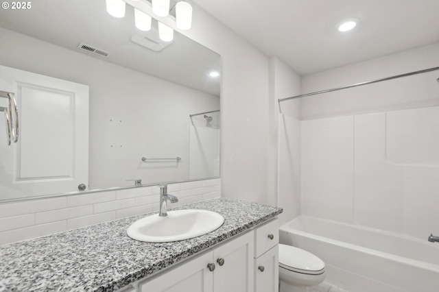 full bathroom featuring washtub / shower combination, vanity, decorative backsplash, and toilet