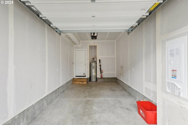 garage featuring a garage door opener and water heater