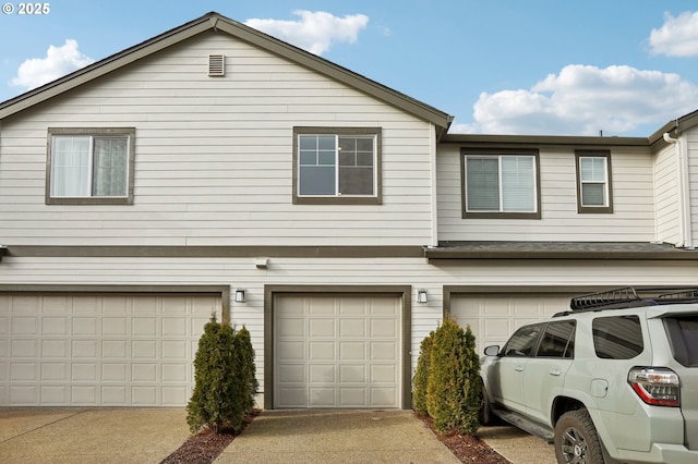 view of side of home featuring a garage