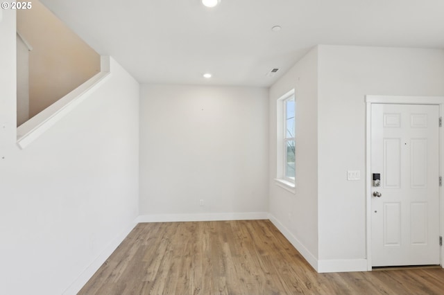 entrance foyer with light hardwood / wood-style flooring