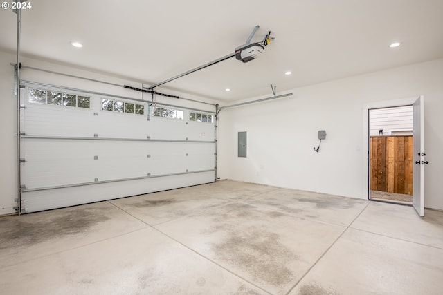 garage featuring a garage door opener and electric panel