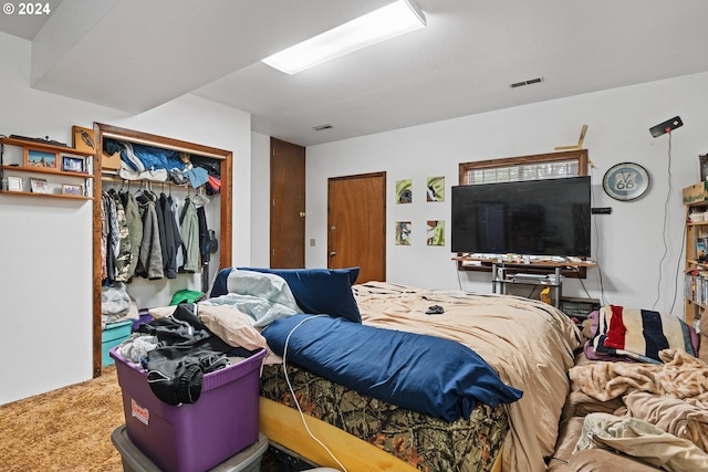 carpeted bedroom featuring a closet