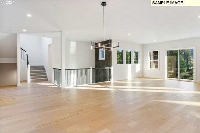 interior space featuring a chandelier and light hardwood / wood-style floors