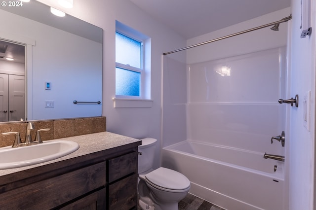 full bathroom with vanity, wood-type flooring, shower / tub combination, and toilet