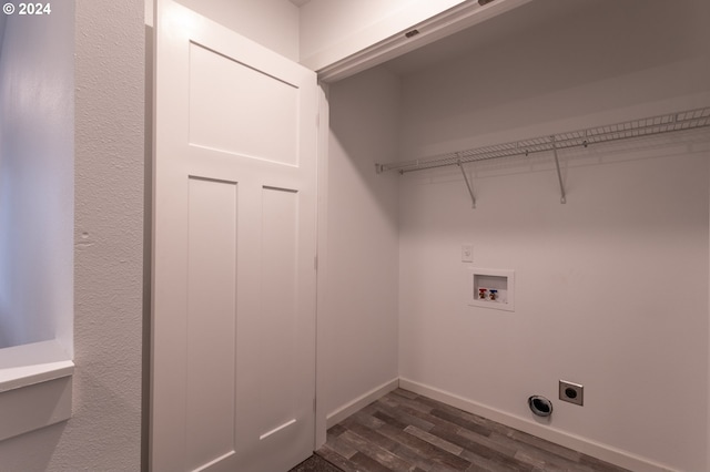 washroom with dark hardwood / wood-style floors, washer hookup, and hookup for an electric dryer