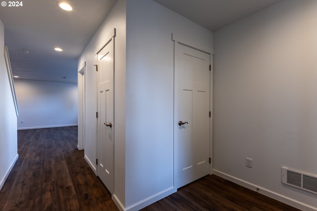 hallway featuring dark hardwood / wood-style flooring