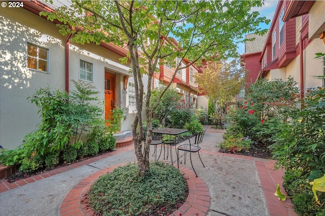 surrounding community featuring a patio area