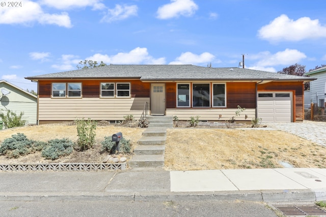 single story home with a garage