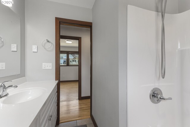 bathroom with vanity and walk in shower