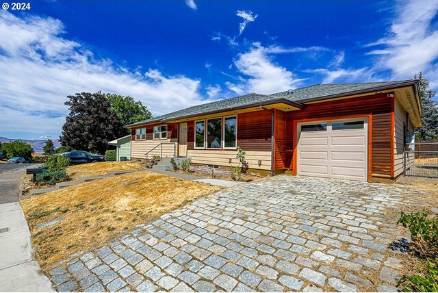 view of front of property with a garage