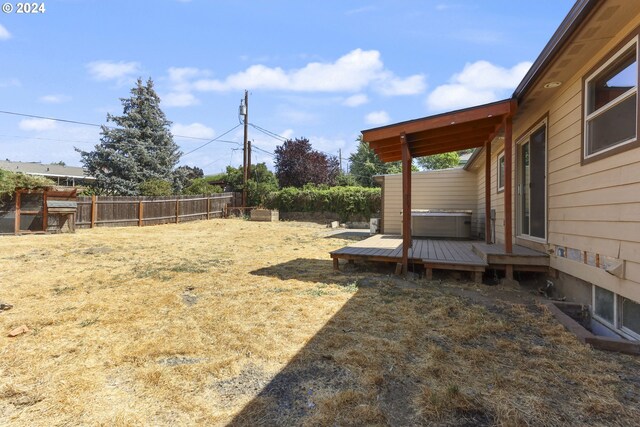 view of yard with a wooden deck