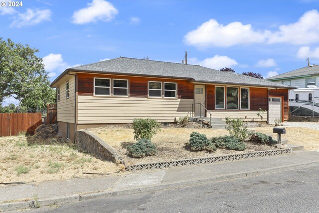 single story home with a garage