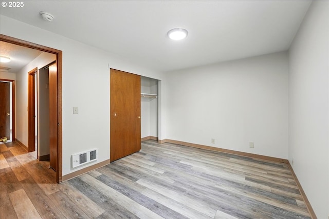 19875 SW Southview St, Beaverton, OR 97078 - unfurnished bedroom with wood finished floors, a closet, and baseboards