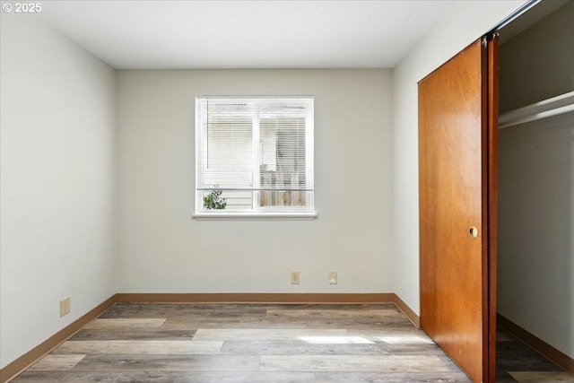 19875 SW Southview St, Beaverton, OR 97078 - unfurnished bedroom featuring wood finished floors, baseboards, and a closet