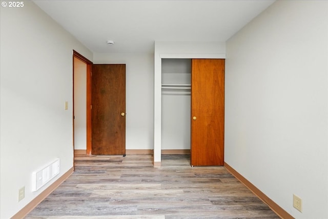 19875 SW Southview St, Beaverton, OR 97078 - unfurnished bedroom with a closet, wood finished floors, and baseboards