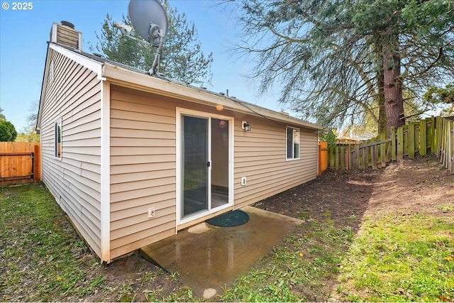 19875 SW Southview St, Beaverton, OR 97078 - rear view of property with a fenced backyard and a chimney