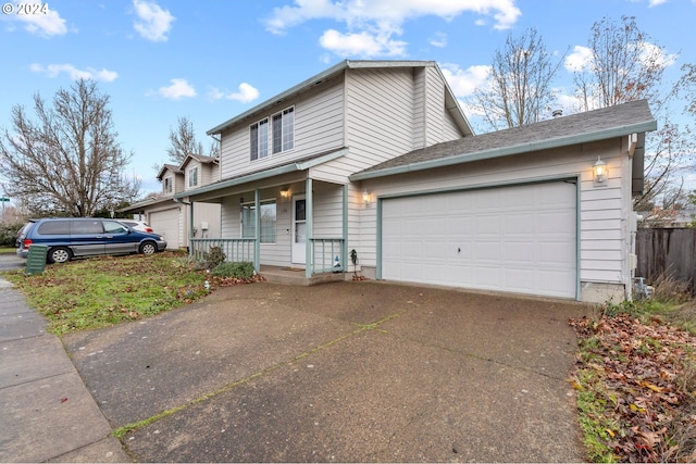 view of property featuring a porch and a garage