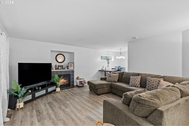 1108 SW Ivory Loop, Gresham, OR 97080 - living area featuring light wood finished floors, a chandelier, and a fireplace