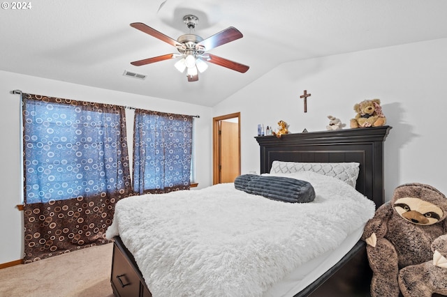 bedroom featuring carpet floors, ceiling fan, and lofted ceiling