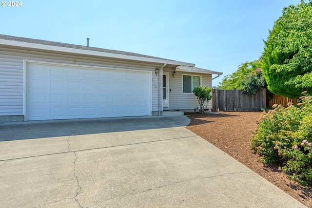 single story home with a garage