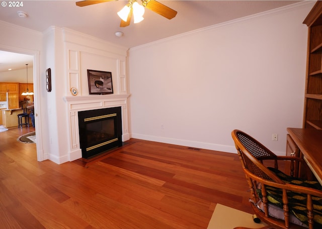 home office with crown molding, ceiling fan, wood-type flooring, and lofted ceiling