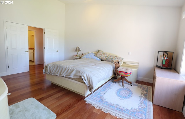 bedroom with hardwood / wood-style floors