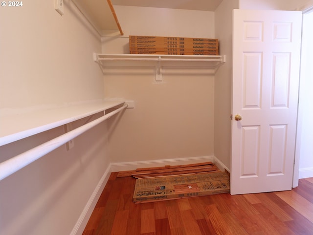 walk in closet featuring hardwood / wood-style floors