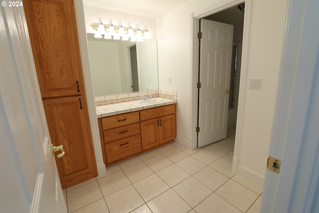 bathroom with tile patterned floors and vanity