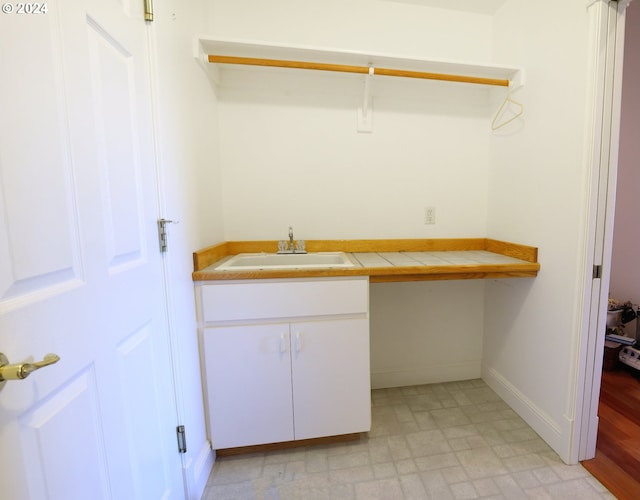 clothes washing area with sink