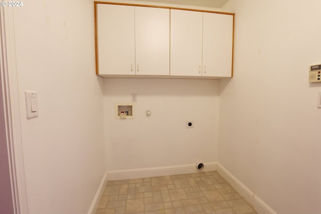 laundry room with electric dryer hookup, hookup for a gas dryer, hookup for a washing machine, and cabinets