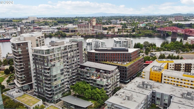 bird's eye view featuring a water view and a view of city