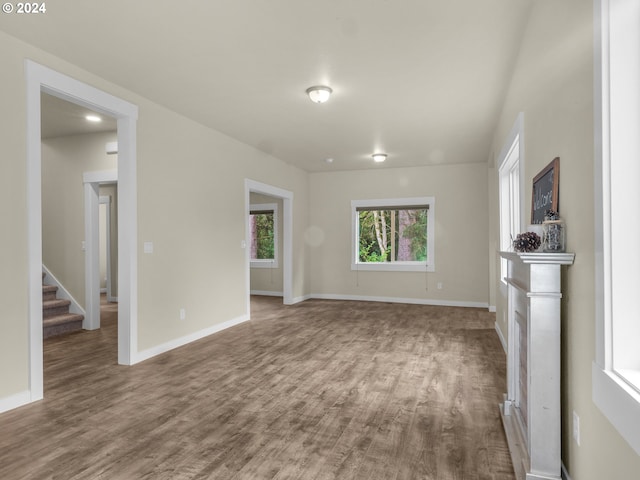 unfurnished living room featuring hardwood / wood-style flooring