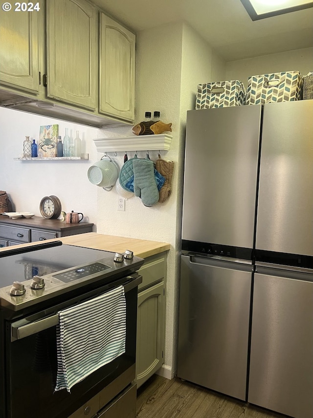 kitchen featuring wood-type flooring and stainless steel appliances