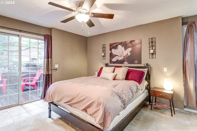 bedroom with ceiling fan and light carpet