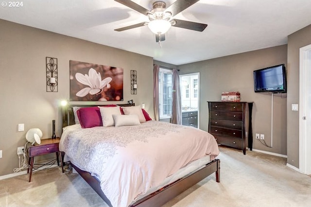 bedroom featuring ceiling fan and light carpet