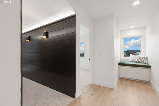 hall with recessed lighting, baseboards, and light wood-style floors