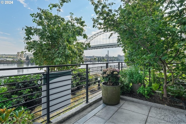 balcony with a view of city and a water view