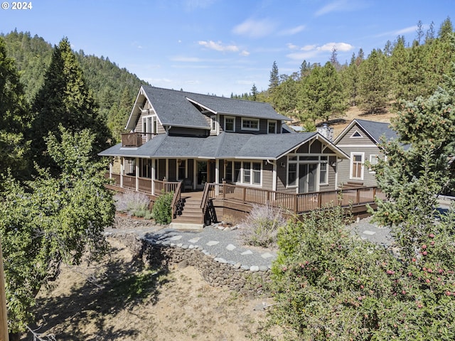 rear view of property with a deck