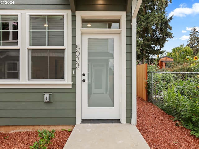 property entrance featuring fence