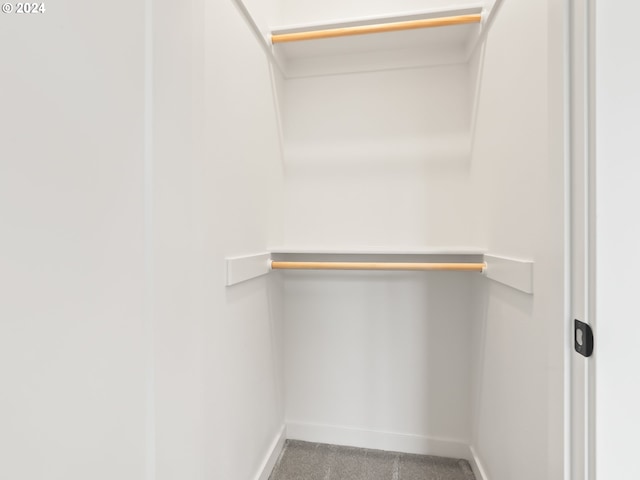 walk in closet featuring carpet