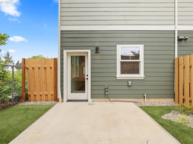 entrance to property with a patio