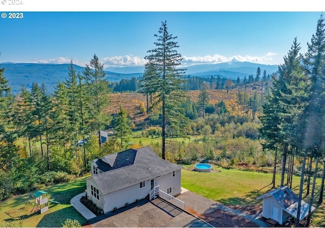 birds eye view of property featuring a mountain view